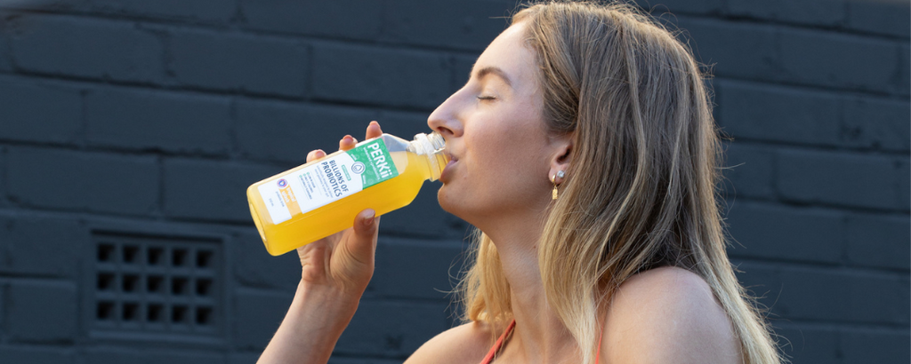 Lady drinking perkii probiotic drink